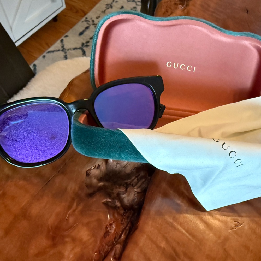Gucci Black Frame Sunglasses with Purple Mirrored Lenses